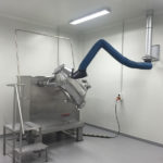 Fume arm in use for pharmaceutical dust extraction